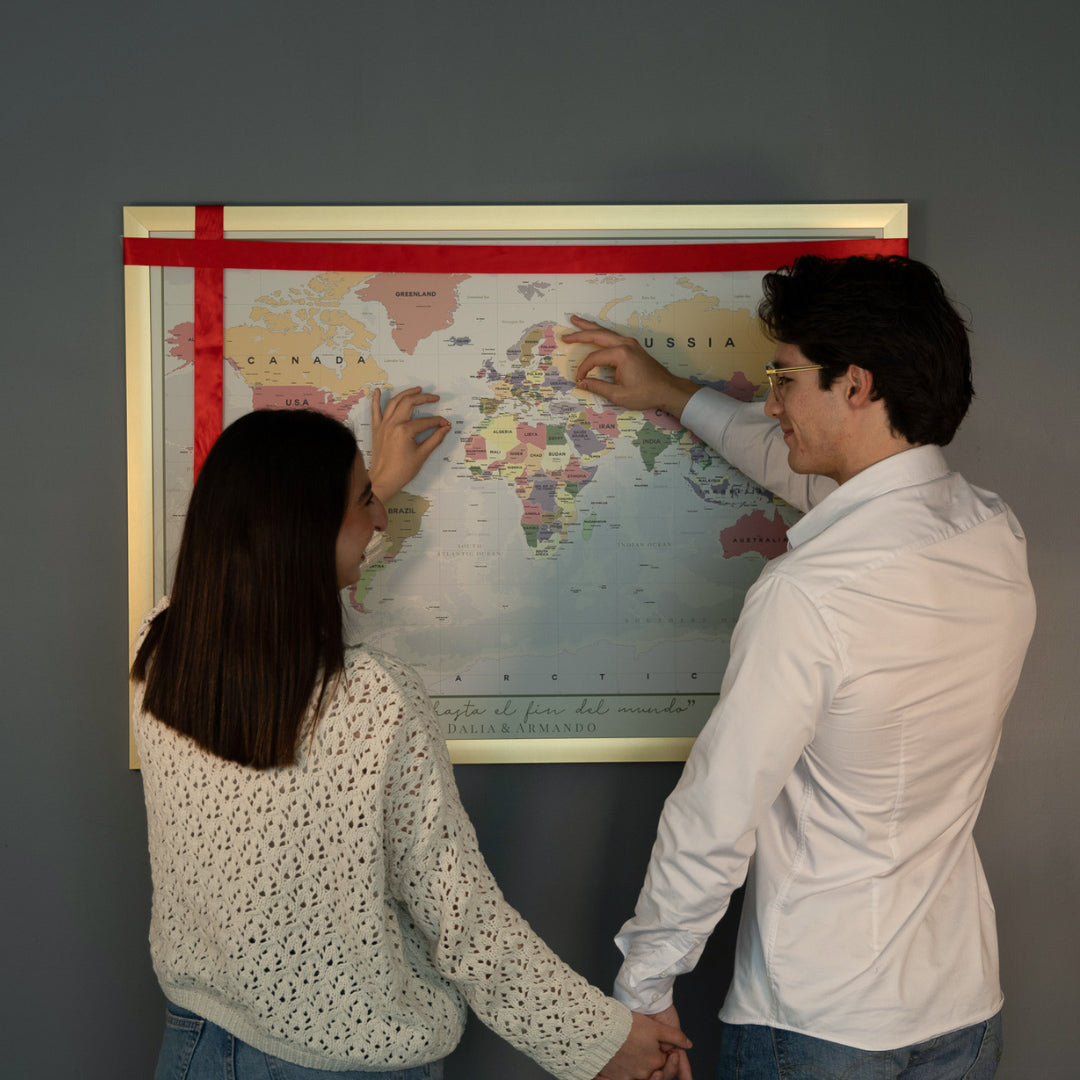 Four pink packing cubes in different sizes stacked together.